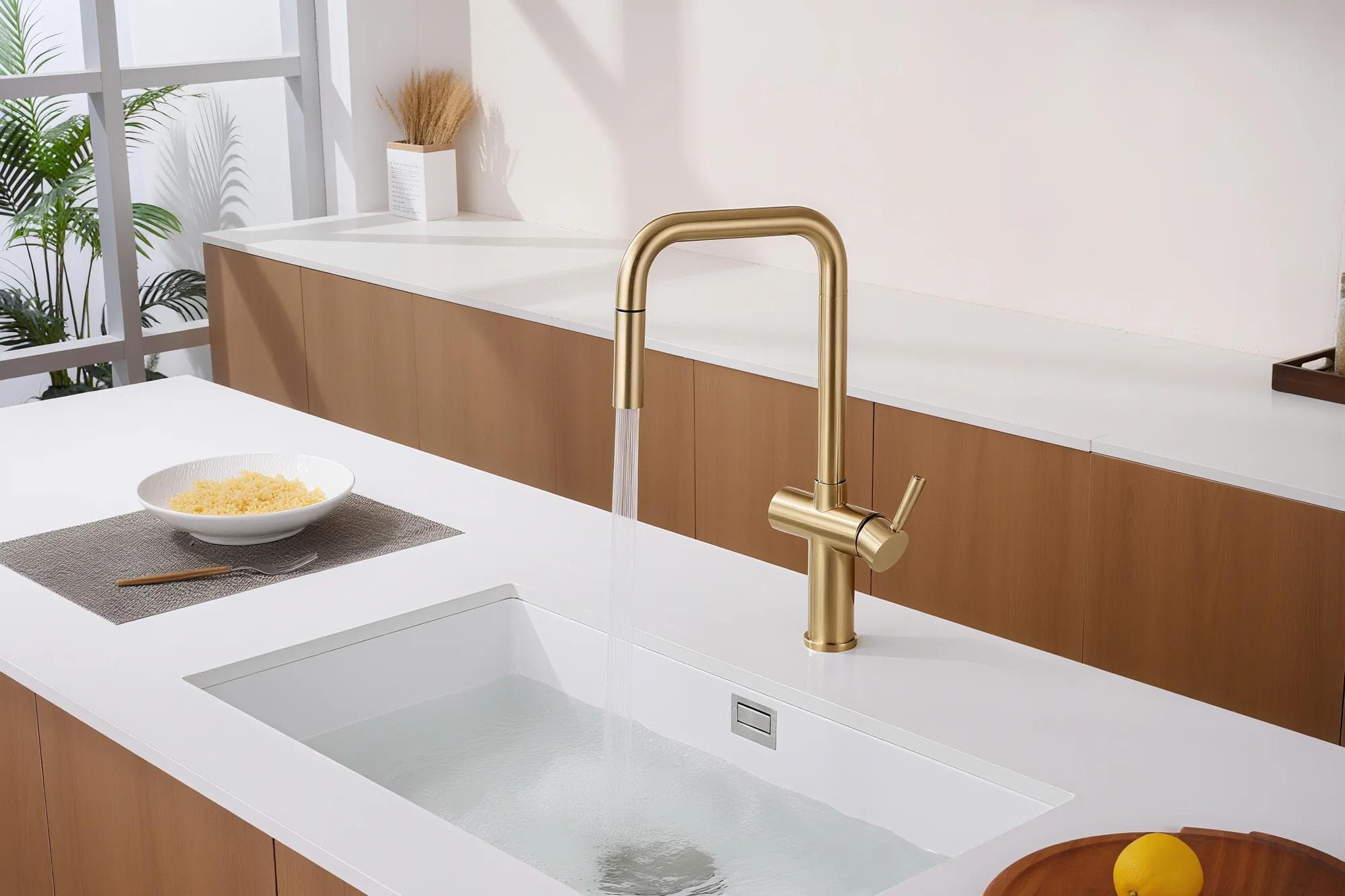 C2-320 brushed gold pull-out faucet installed in a modern residential kitchen